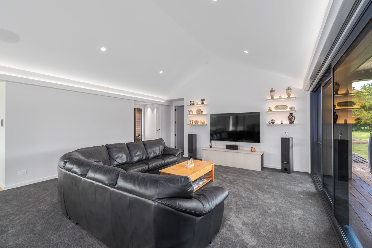 Living room wider angle with vaulted ceiling and sliding doors