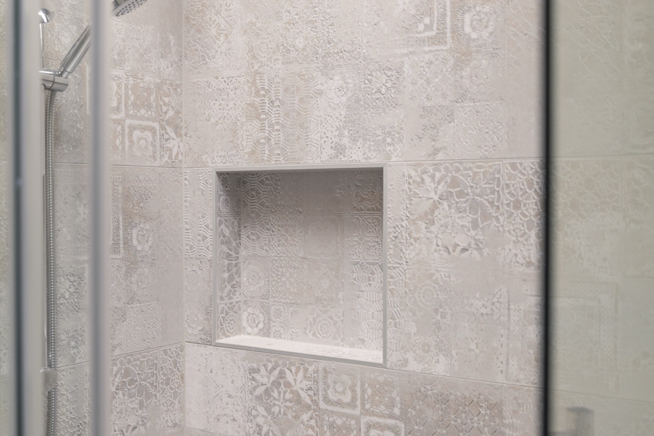 Patterned shower tile detail with built-in niche