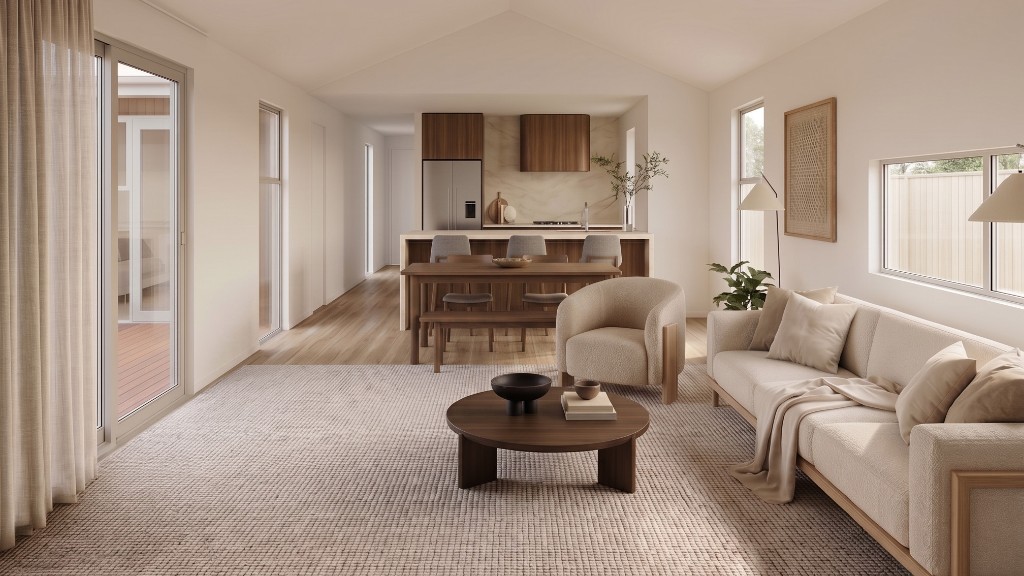 Open-plan living and kitchen — light-filled lounge with the kitchen island beyond